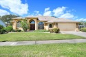 Located in the popular golf community of the Savannahs, this for sale in Merritt Island Florida Brevard County County on GolfHomes.com