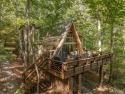 Escape to your own lakeside paradise at this super cute chalet for sale in Innsbrook Missouri Warren County County on GolfHomes.com