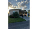 This exclusive listing is on leased land with a monthly lot rent for sale in Auburndale Florida Polk County County on GolfHomes.com