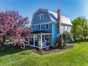 Discover timeless charm and classic North Fork living in this for sale in Cutchogue New York Suffolk County County on GolfHomes.com