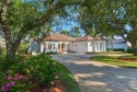 Custom home located on a beautiful lake and Raven Oaks 18th hole for sale in Miramar Beach Florida Walton County County on GolfHomes.com