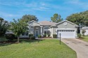 This bright beautiful home says Florida from the time you pull for sale in Leesburg Florida Lake County County on GolfHomes.com