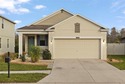 LOVE WHERE YOU LIVE! This turnkey 3-bedroom, 2-bath home offers for sale in Land O Lakes Florida Pasco County County on GolfHomes.com