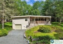 Step into this 3-bedroom, 2-bath Lake Harmony home showcasing for sale in Kidder Twp S Pennsylvania Carbon County County on GolfHomes.com