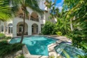 Indulge in resort-style living in this tropical paradise on for sale in Miami Beach Florida Miami-Dade County County on GolfHomes.com