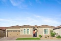 Located in the newer Mountain Side of Sun City Festival, this for sale in Buckeye Arizona Maricopa County County on GolfHomes.com