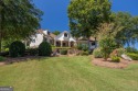 One of a kind custom home in River Forest. This home boasts curb for sale in Forsyth Georgia Monroe County County on GolfHomes.com