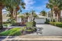 This stunning home is nestled on a serene lake in a highly for sale in West Palm Beach Florida Palm Beach County County on GolfHomes.com