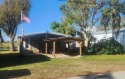 Directly on Taylor Creek canal and on Lucy Island, is the for sale in Okeechobee Florida Okeechobee County County on GolfHomes.com