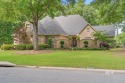 Step through the walled courtyard entrance into this exquisite for sale in Fairhope Alabama Baldwin County County on GolfHomes.com