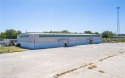8.50+/- industrial-zoned acres with approximately 29,000 square for sale in Booneville Arkansas Logan County County on GolfHomes.com