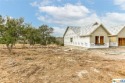 CHANGE IN BUYERS PLANS IS ALLOWING YOU A RARE OPPORTUNITY TO OWN for sale in Blanco Texas Blanco County County on GolfHomes.com