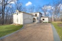 You'll find this home alongside the lush rolling greens nestled for sale in Sunrise Beach Missouri Camden County County on GolfHomes.com