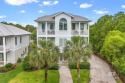 Discover luxury living in the sought-after Kiva Dunes beach & for sale in Gulf Shores Alabama Baldwin County County on GolfHomes.com