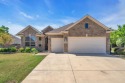 This beautiful fully bricked Briscoe model on a premium for sale in Denton Texas Denton County County on GolfHomes.com