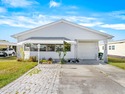 Welcome to your dream home in Barefoot Bay! This spacious for sale in Barefoot Bay Florida Brevard County County on GolfHomes.com