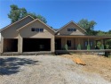 This uniquely custom-designed home at The National offers for sale in Parkville Missouri Platte County County on GolfHomes.com