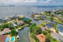 Tucked away in one of Gulf Breeze's most desirable waterfront for sale in Gulf Breeze Florida Santa Rosa County County on GolfHomes.com
