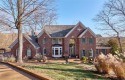 A stunning one-and-a-half-story all-brick home sits on 1 1/2 for sale in Saint Albans Missouri Franklin County County on GolfHomes.com