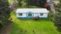 The charming Manufactured home features an open floor plan for sale in Willow Creek California Humboldt County County on GolfHomes.com