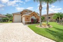 This exquisite poured concrete 3BR/3b plus loft home is located for sale in Titusville Florida Brevard County County on GolfHomes.com