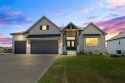 This 4-bedroom, 4-bath reverse 1.5-story is packed with upgrades for sale in Olathe Kansas Johnson County County on GolfHomes.com