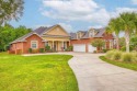Discover your own private paradise in this stunning custom-built for sale in Pace Florida Santa Rosa County County on GolfHomes.com