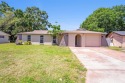 Nestled just minutes from the vibrant downtown area, this for sale in New Port Richey Florida Pasco County County on GolfHomes.com
