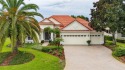 Set on a beautiful private lot with serene water views, this for sale in Lakewood Ranch Florida Manatee County County on GolfHomes.com