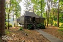 This one-of-a-kind 3 BR / 2 BATH designed villa sits directly on for sale in Big Canoe Georgia Pickens County County on GolfHomes.com