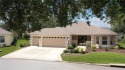 This TURNKEY Block and Stucco Designer Home with GOLF CART for sale in The Villages Florida Sumter County County on GolfHomes.com