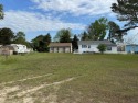 Clear and flat lot in Trails End.  Includes access to pool, dock for sale in Horntown Virginia Accomack County County on GolfHomes.com