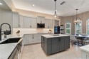 Poised on a secluded preserve-facing lot, this impressively for sale in Fort Myers Florida Lee County County on GolfHomes.com
