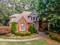 Welcome home! This stunning 4-sided brick 4 bedroom / 4.5 for sale in Flowery Branch Georgia Hall County County on GolfHomes.com