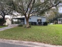 NEW PRICE .... Charming manufactured home in a Gated Community for sale in Lady Lake Florida Lake County County on GolfHomes.com