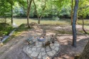 Riverfront living at it's finest with 110 feet of river frontage for sale in Ellijay Georgia Gilmer County County on GolfHomes.com