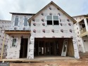 The Ashley plan built by Heatherland Homes. Enjoy for sale in Marietta Georgia Cobb County County on GolfHomes.com