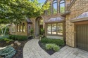 Tucked away in a quiet cul-de-sac on a private, treed lot, this for sale in Olathe Kansas Johnson County County on GolfHomes.com