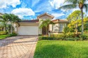 Experience resort-style living in this stunning two-bedroom + for sale in Bonita Springs Florida Lee County County on GolfHomes.com