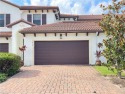 Freshly painted townhouse with master bedroom in downstairs for sale in Naples Florida Collier County County on GolfHomes.com