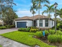 Nestled on a prime corner lot in Del Webb, this stunning for sale in Ave Maria Florida Collier County County on GolfHomes.com