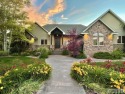 ENDLESS SUNSETS & lush landscaping in this updated CUSTOM home for sale in Ammon Idaho Bonneville County County on GolfHomes.com