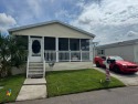 How would you like a view of the water from your front porch for sale in Plant City Florida Hillsborough County County on GolfHomes.com
