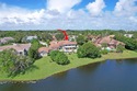 NEARLY ONE ACRE LOT! Breathtaking lakefront beauty is showcased for sale in Palm Beach Gardens Florida Palm Beach County County on GolfHomes.com