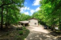 What a warm, inviting, and comfortable lakefront house located for sale in Linn Creek Missouri Camden County County on GolfHomes.com