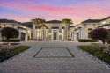 This exquisite custom estate home, nestled within the for sale in Wellington Florida Palm Beach County County on GolfHomes.com