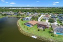 Waterfront home with a private saltwater pool & spa and 3-car for sale in Kissimmee Florida Osceola County County on GolfHomes.com