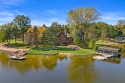 Lakefront Log Home – Private Beach & Docks on Lake Camelot for sale in Nekoosa Wisconsin Adams County County on GolfHomes.com