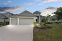 This stunning two-story home is a sight to behold, boasting a for sale in Bradenton Florida Manatee County County on GolfHomes.com