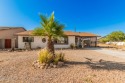 Move into this charming single-level home with a gated carport for sale in Arizona City Arizona Pinal County County on GolfHomes.com